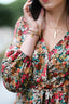 Kopertowa sukienka w kwiaty wiązana w talii wyszczuplająca REUS MIDI CLARISA